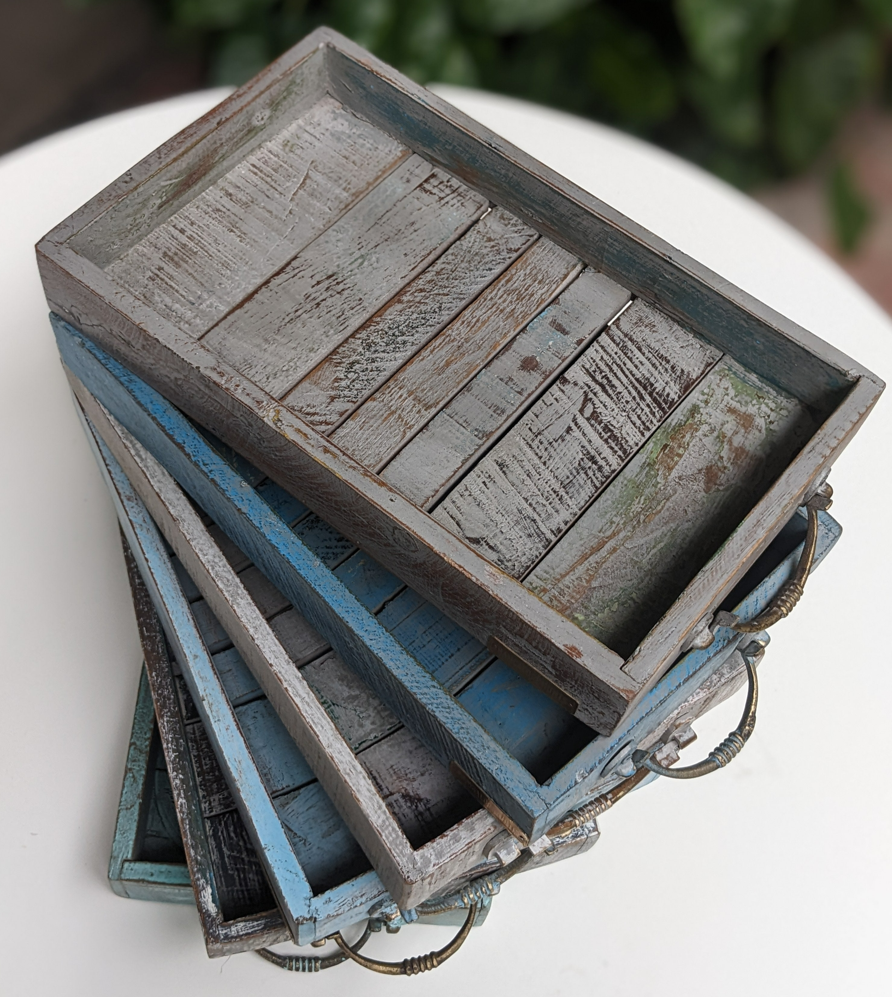 Decorative wooden trays in distressed colours