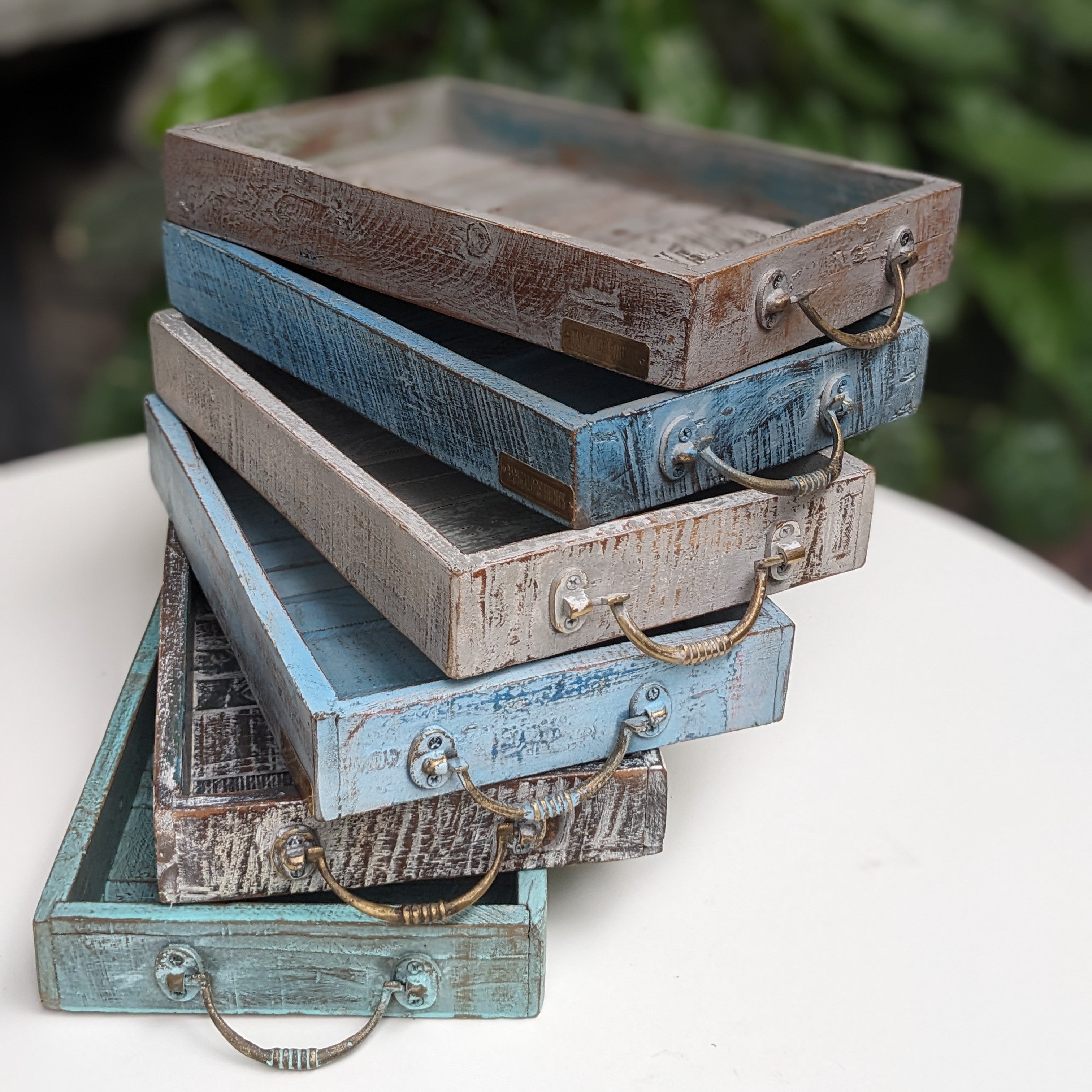 Decorative wooden trays in distressed colours