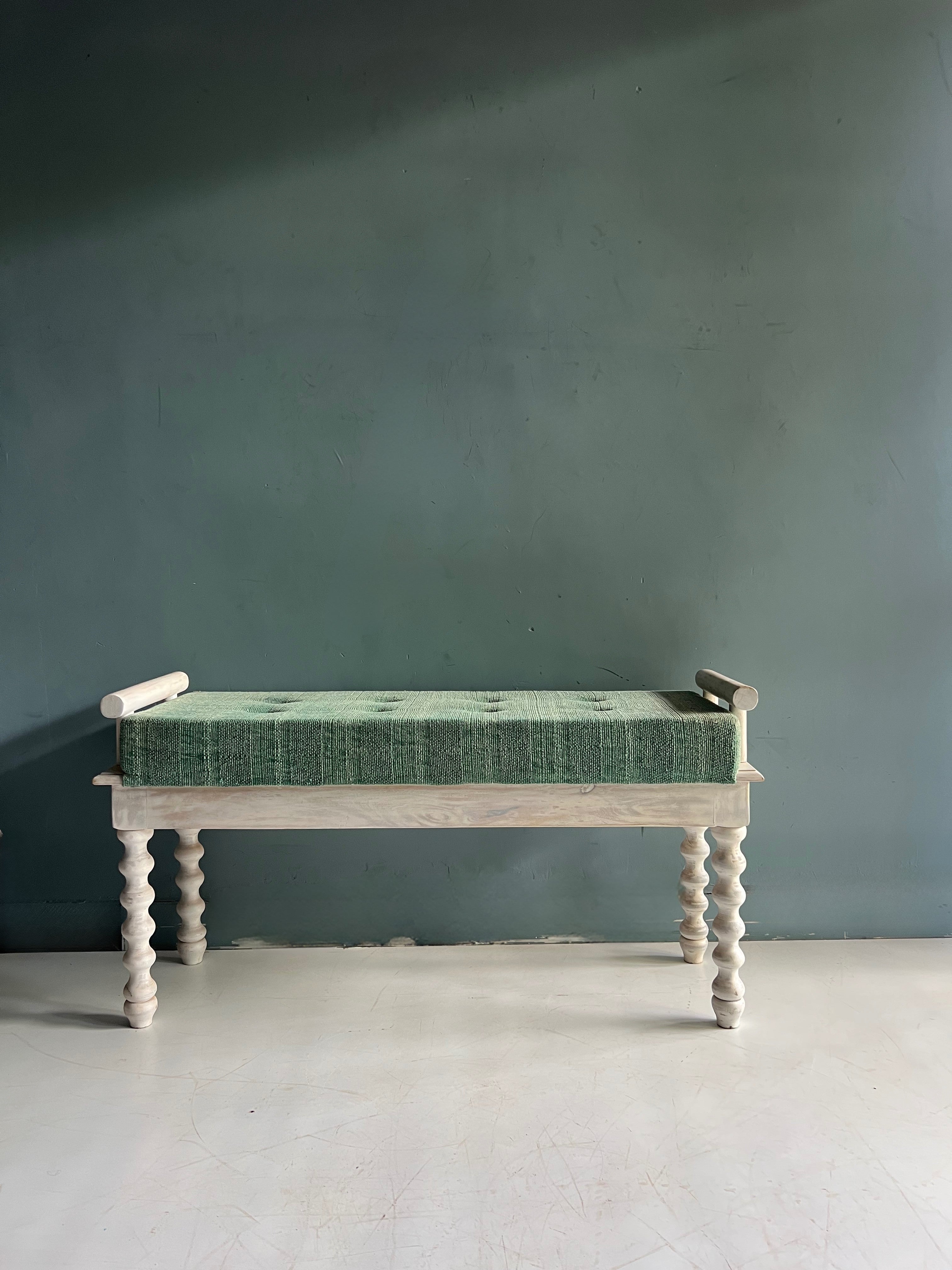 Twist leg wooden bench with green upholstery