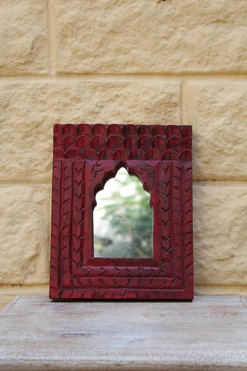 Red carved mirror